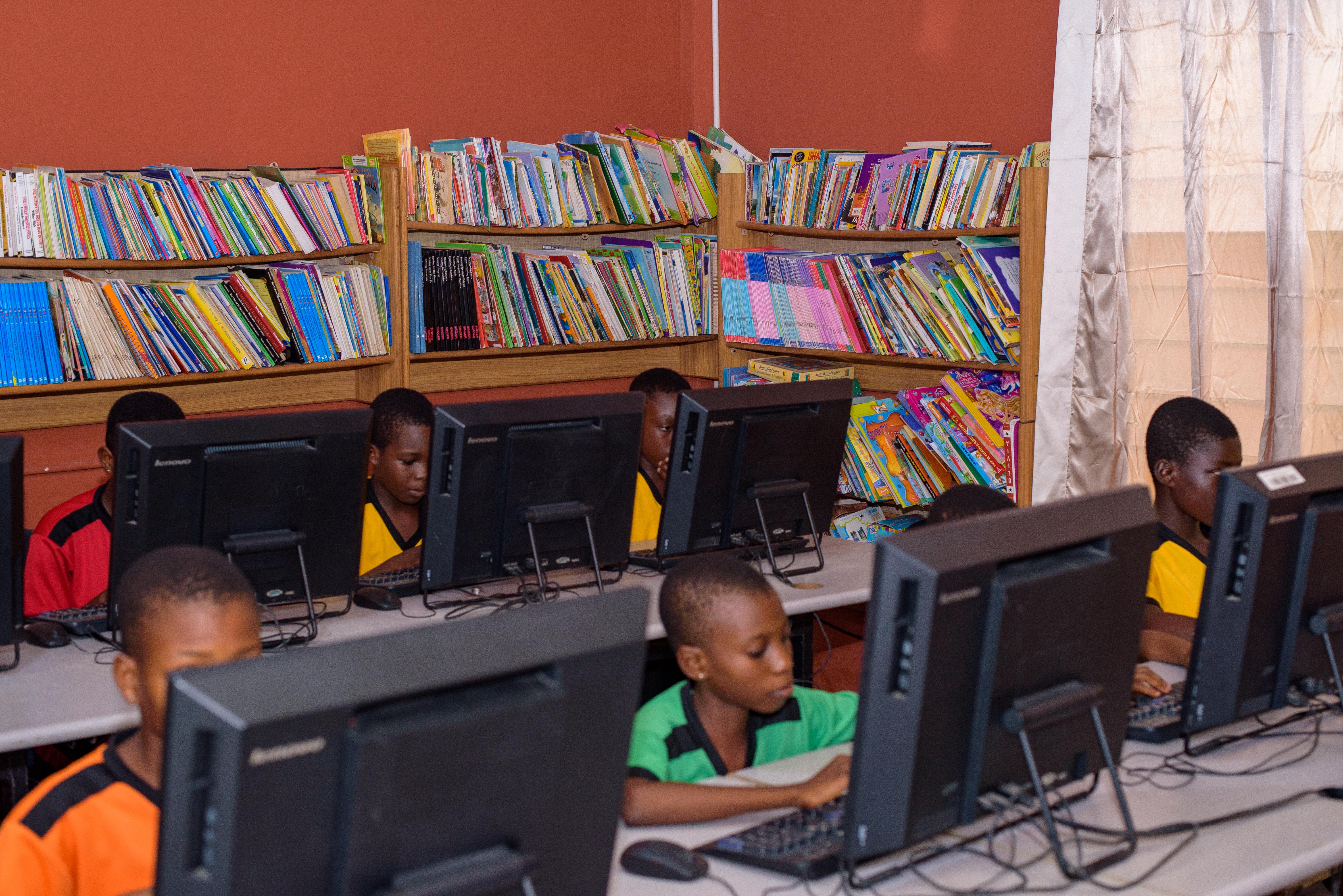 Pupils attending a computer class at their school Discovery Bay International School in the Ghanaian Volta Region