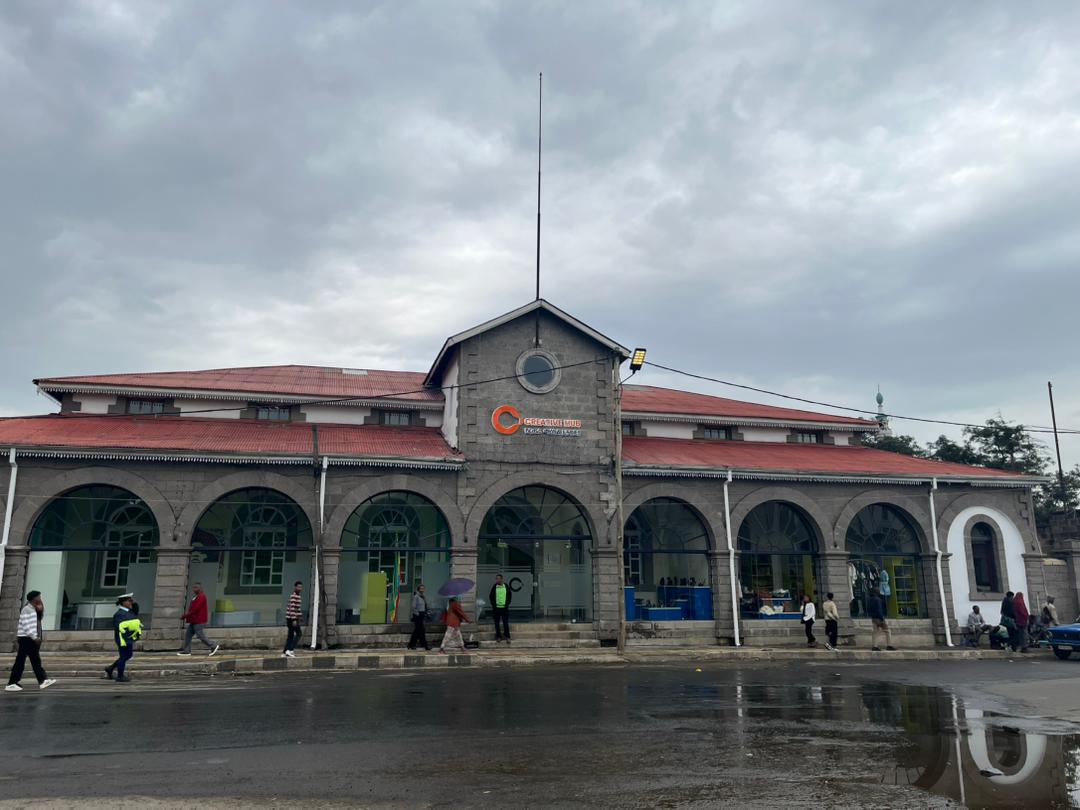 photo of a building with red roof in a cloudy and rainy weather