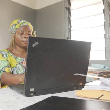 Entrepreneur sits in front of computer and works