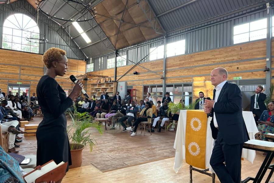 Florence Mogere, WIDU entrepreneur and owner of Nyota Limited, talks to German Chancellor Olaf Scholz. Copyright: WIDU.africa
