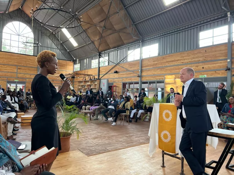 Florence Mogere, WIDU entrepreneur and owner of Nyota Limited, talks to German Chancellor Olaf Scholz. Copyright: WIDU.africa